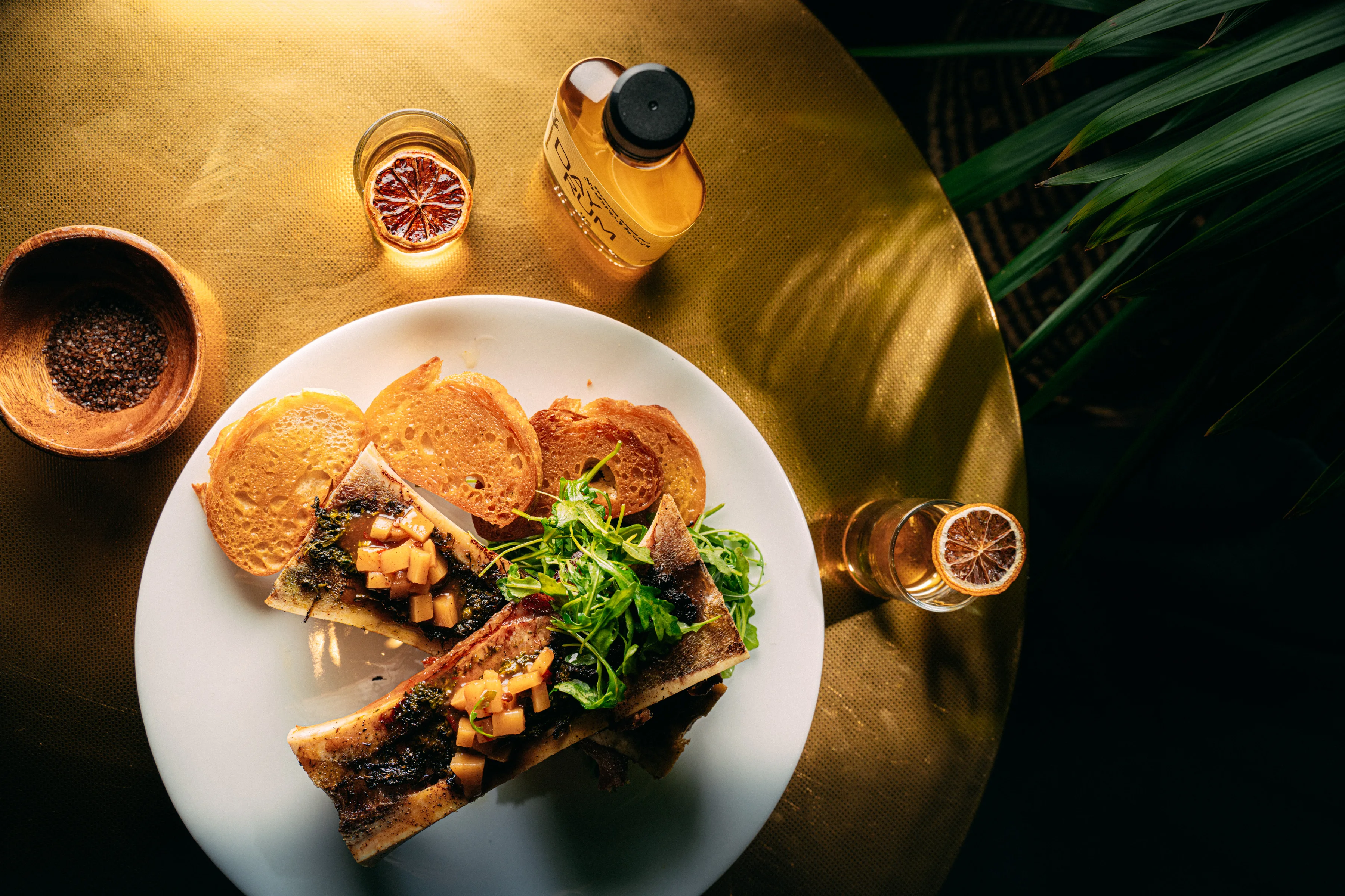 Roasted bone marrow with toast and cocktails at Sobre Mesa
